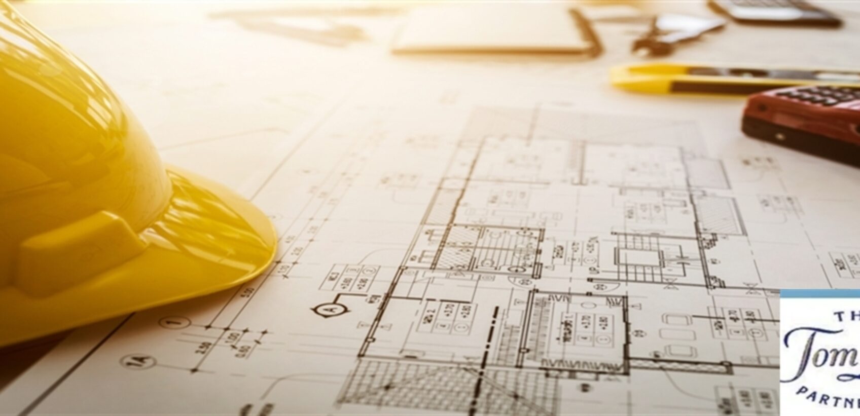 om Lucas Partnetship Building Surveyor hard hat plans business phone systems