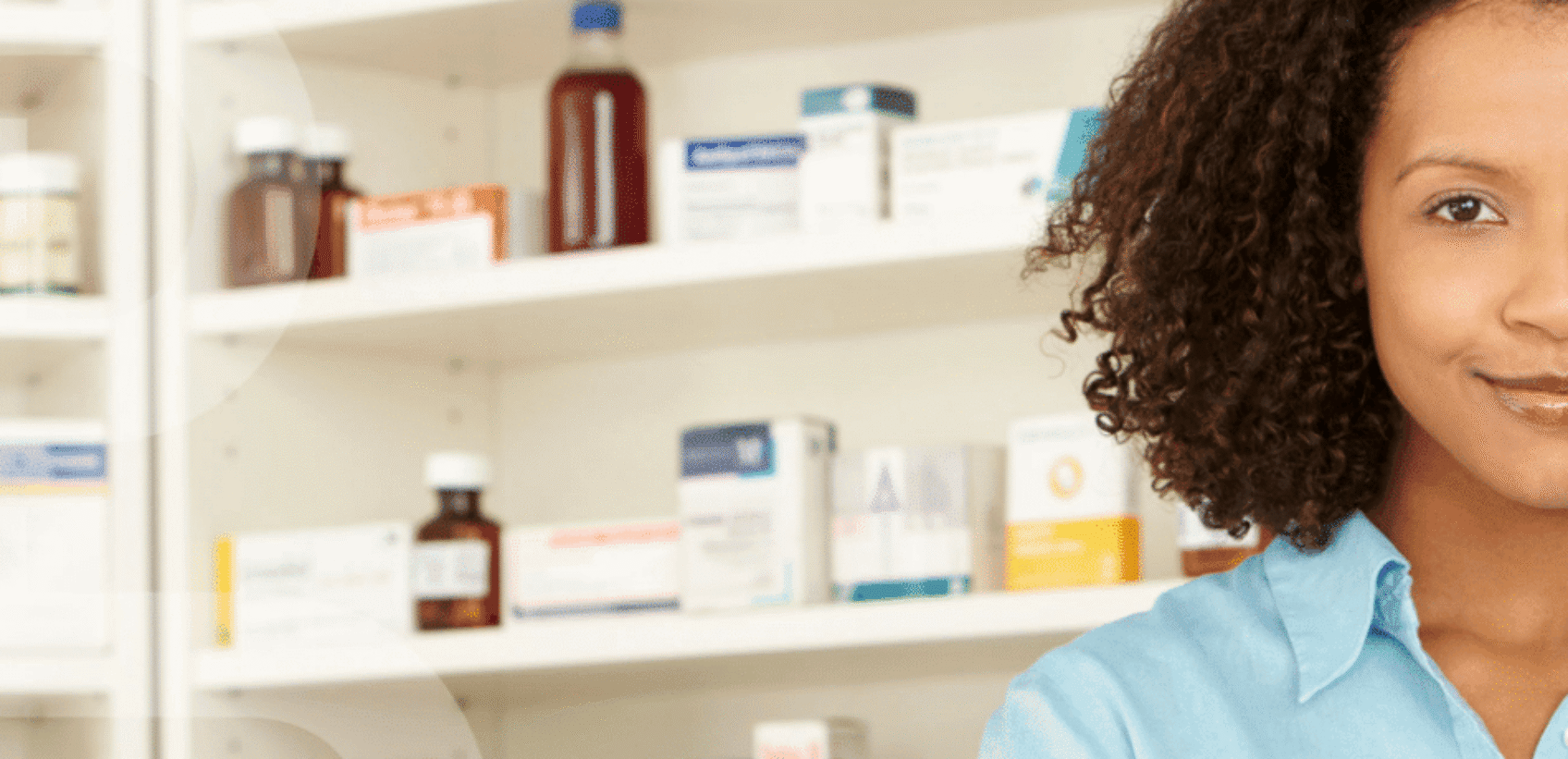 Lady smiling in a pharmacy