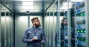 Engineer looking at server racks